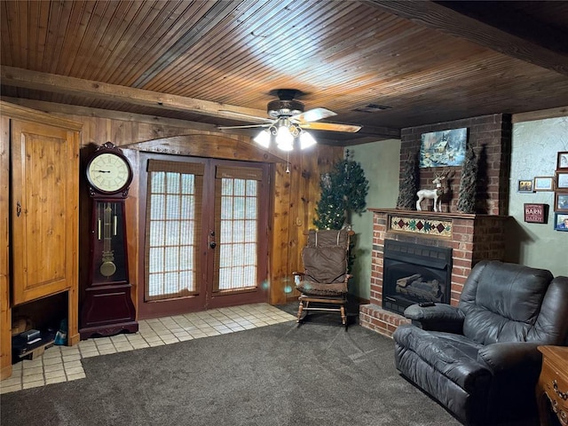 unfurnished living room featuring a fireplace, carpet flooring, wood ceiling, and visible vents
