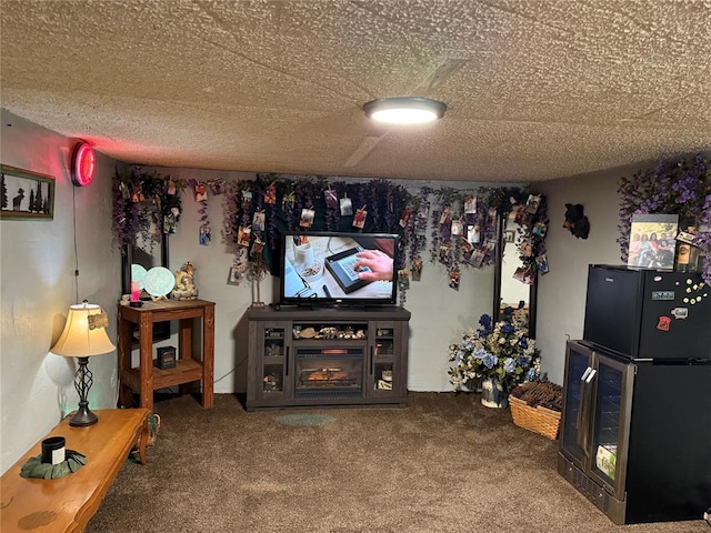 carpeted living room featuring a textured ceiling