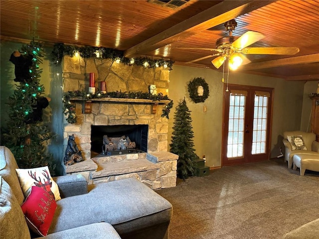 living area with beam ceiling, carpet, wooden ceiling, a fireplace, and ceiling fan