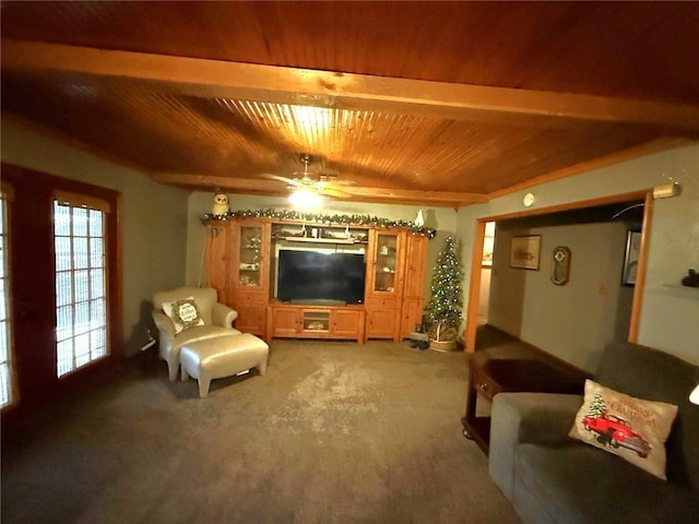 carpeted living area with a ceiling fan, beamed ceiling, and wood ceiling
