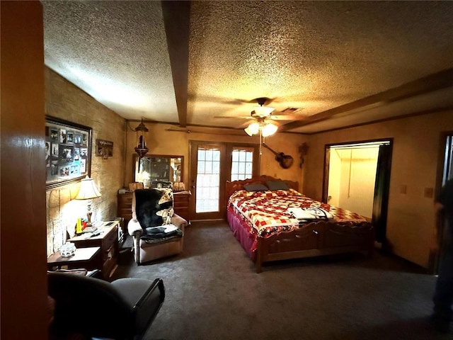 bedroom featuring visible vents, carpet floors, a textured ceiling, and ceiling fan