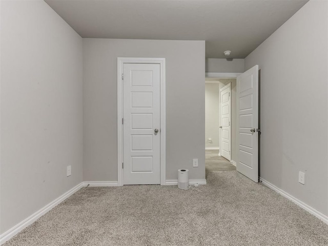 unfurnished bedroom with carpet flooring