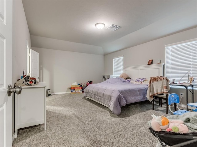 carpeted bedroom featuring vaulted ceiling