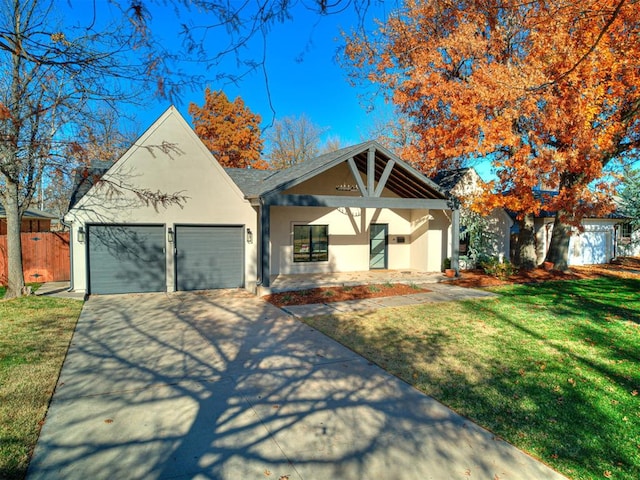 view of front of property with a front lawn and a garage