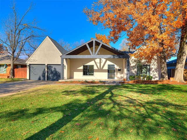 view of front of property featuring a garage and a front yard