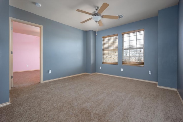 carpeted empty room with ceiling fan