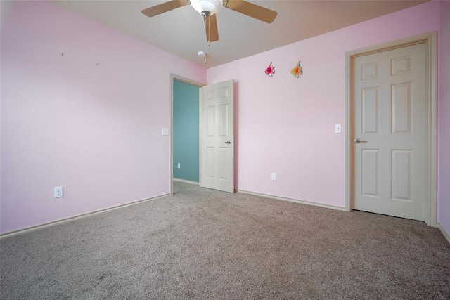 unfurnished bedroom with carpet flooring and ceiling fan