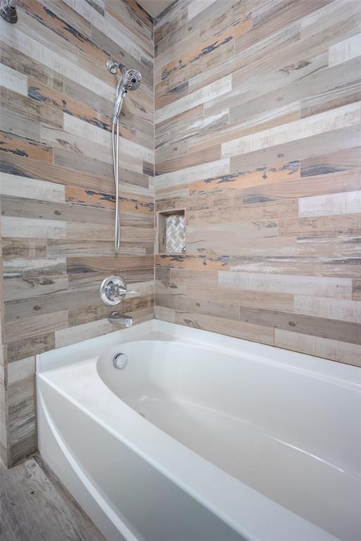 bathroom featuring wood walls