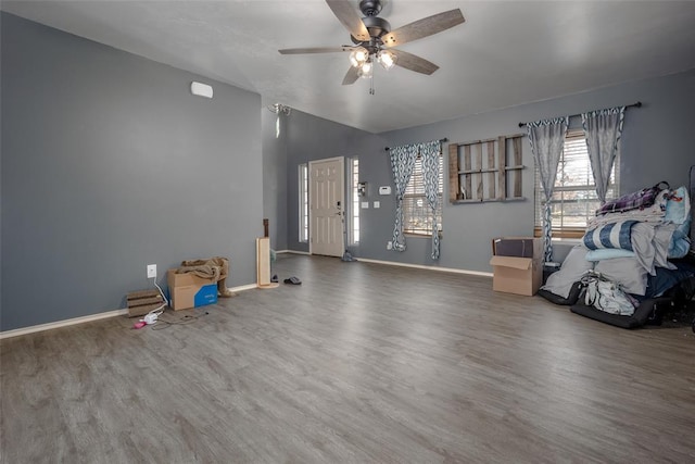 misc room with hardwood / wood-style floors and ceiling fan