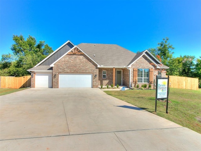 view of front of house featuring a front yard and a garage