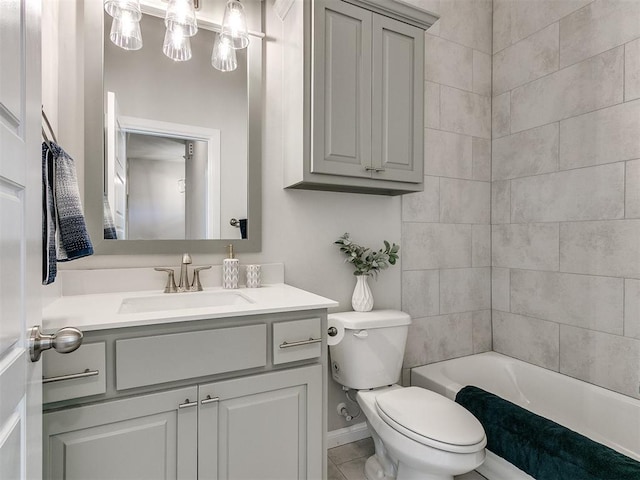 full bathroom with tiled shower / bath, vanity, and toilet