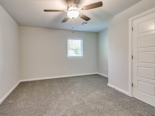 unfurnished room featuring ceiling fan and carpet