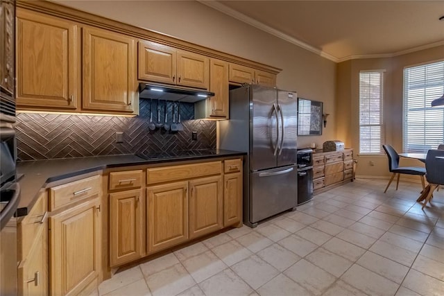 kitchen featuring backsplash, stainless steel fridge, light tile patterned floors, and crown molding