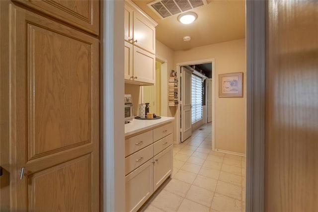 interior space featuring light tile patterned floors