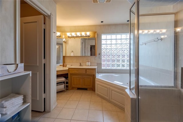 bathroom featuring tile patterned floors, vanity, and separate shower and tub