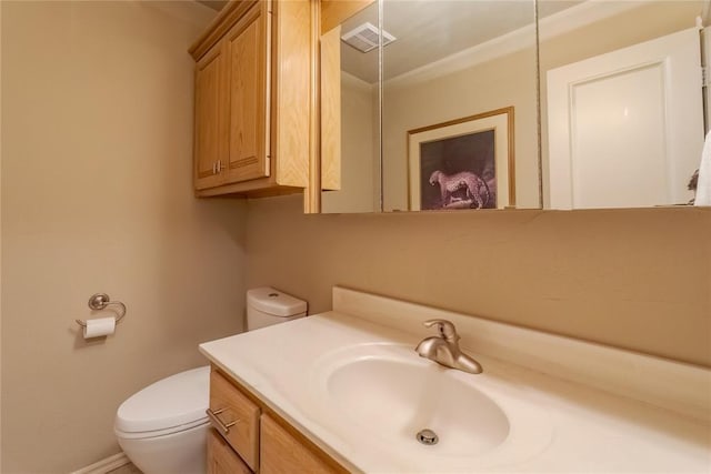 bathroom featuring vanity and toilet