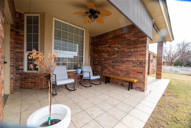 view of patio featuring ceiling fan