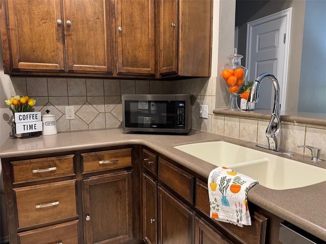 kitchen featuring sink and backsplash