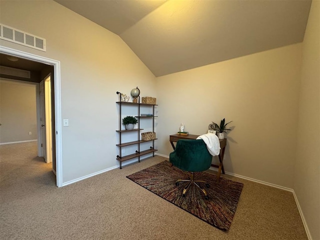 carpeted office space featuring lofted ceiling