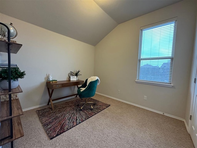 home office featuring vaulted ceiling, carpet flooring, and a wealth of natural light