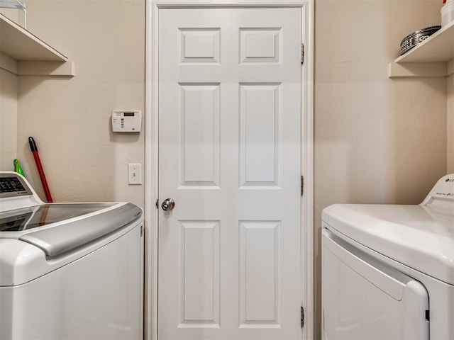 washroom featuring washer and dryer