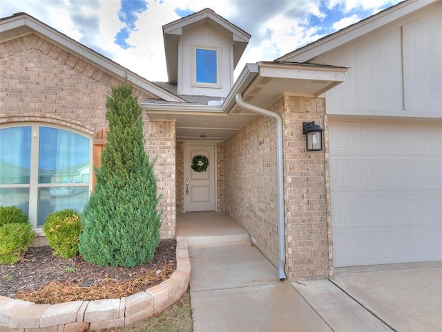 view of exterior entry with a garage