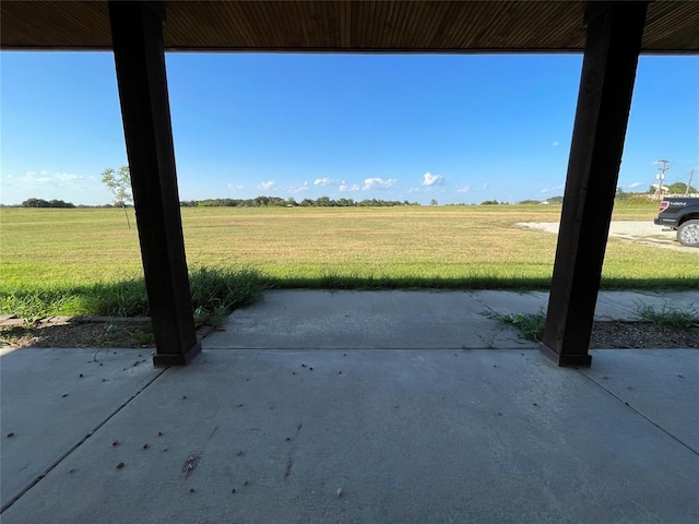 view of patio / terrace with a rural view