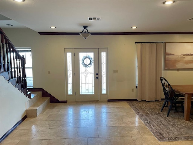 foyer entrance featuring recessed lighting, visible vents, and baseboards