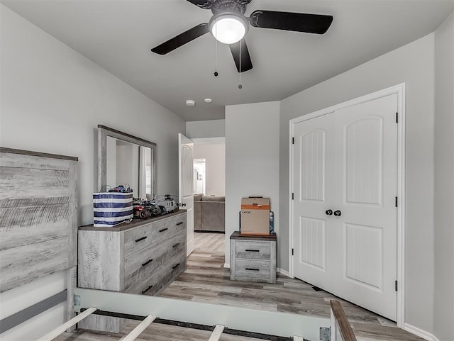 bedroom featuring ceiling fan and light hardwood / wood-style floors