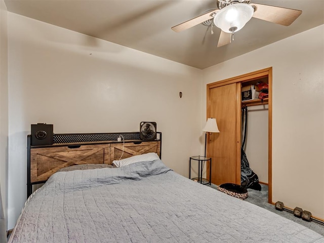 carpeted bedroom featuring a closet and ceiling fan