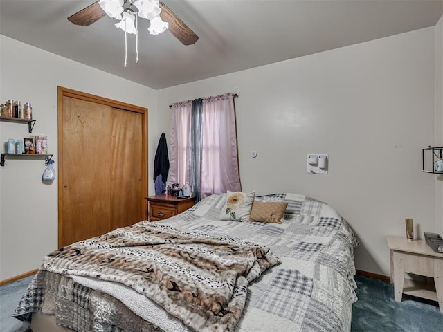 carpeted bedroom with ceiling fan and a closet