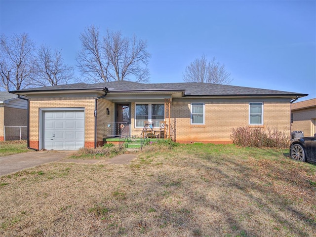 single story home with a front lawn, covered porch, and a garage