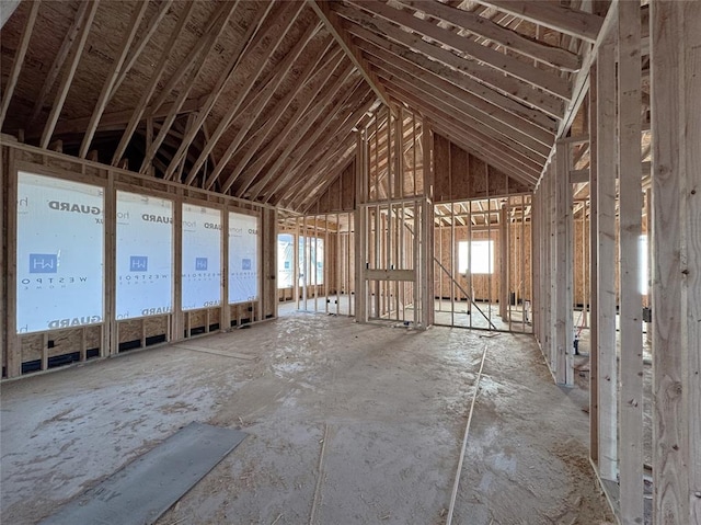 miscellaneous room featuring high vaulted ceiling