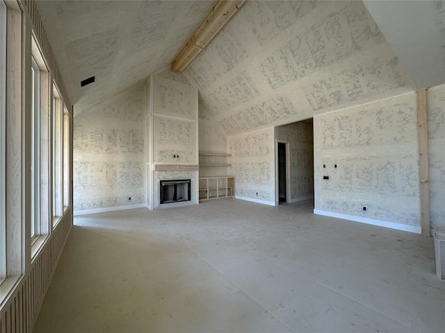 unfurnished living room with a fireplace, visible vents, vaulted ceiling, concrete flooring, and baseboards