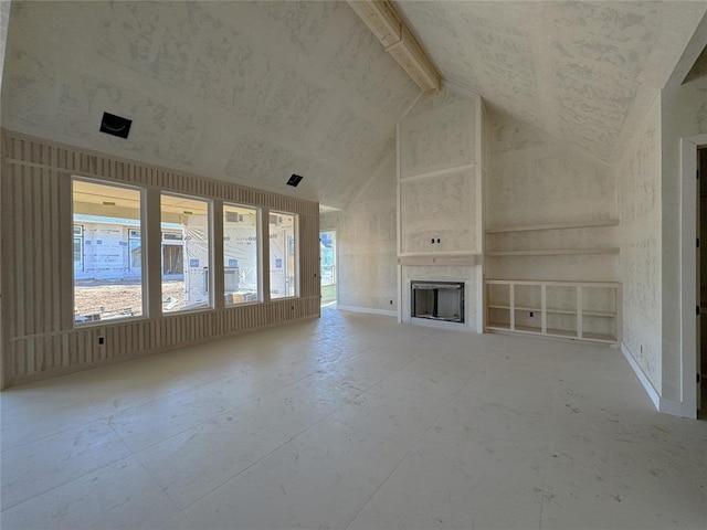 unfurnished living room featuring a fireplace and high vaulted ceiling