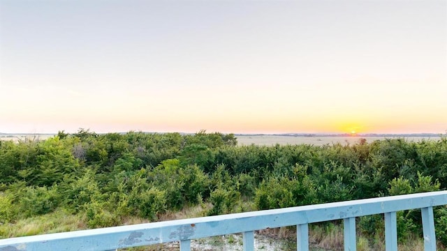 view of balcony at dusk