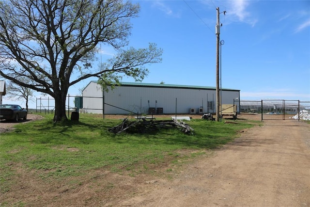 view of side of home featuring an outdoor structure