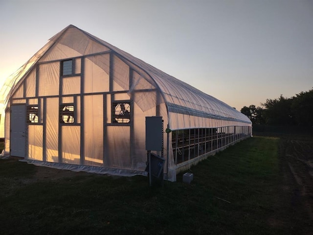 view of outdoor structure at dusk