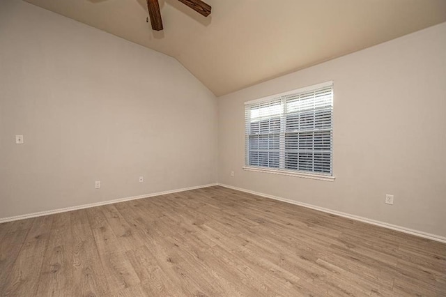 unfurnished room featuring ceiling fan, light hardwood / wood-style floors, and lofted ceiling