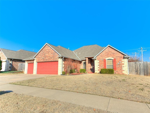 view of front facade featuring a front yard and a garage