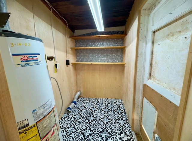 utility room featuring water heater