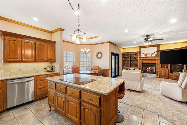 kitchen featuring pendant lighting, light tile patterned floors, stainless steel dishwasher, and a kitchen island