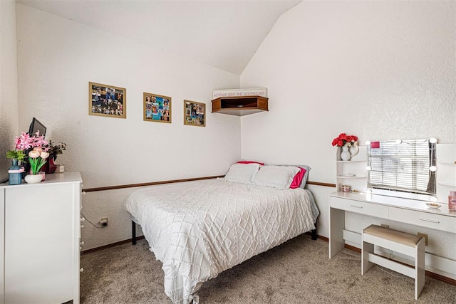 bedroom with light carpet and lofted ceiling