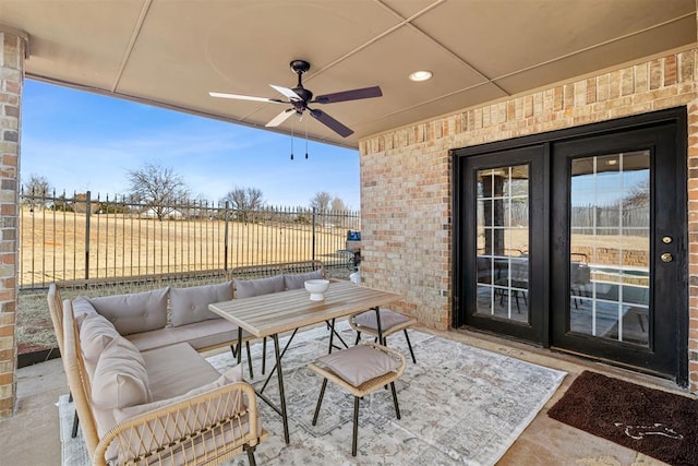 view of patio featuring ceiling fan, french doors, and an outdoor hangout area