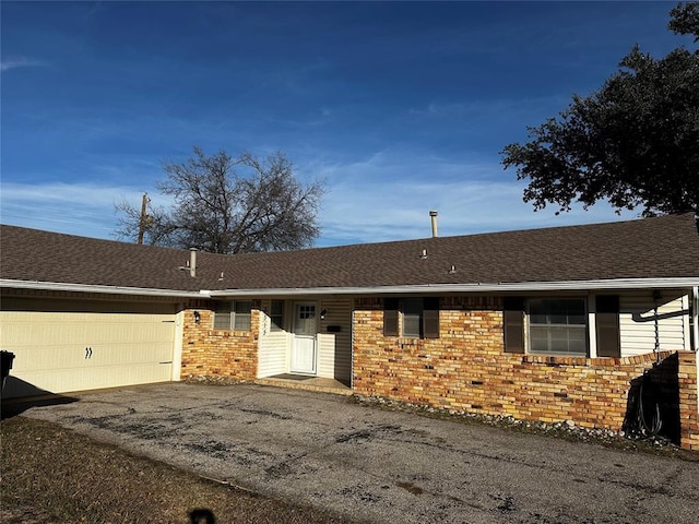 ranch-style house featuring a garage