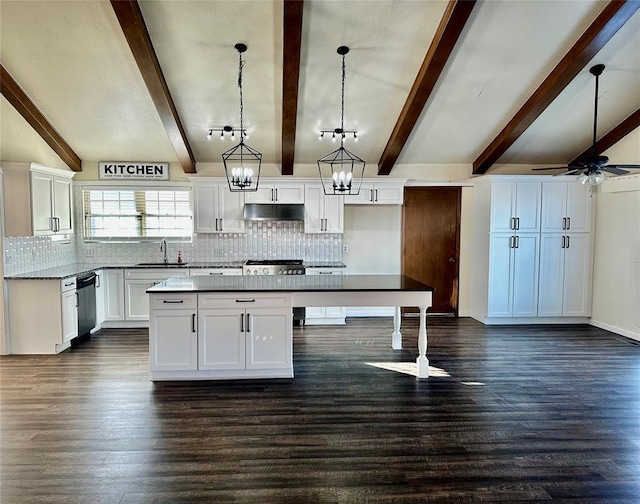 kitchen with white cabinets, pendant lighting, a center island, and ceiling fan