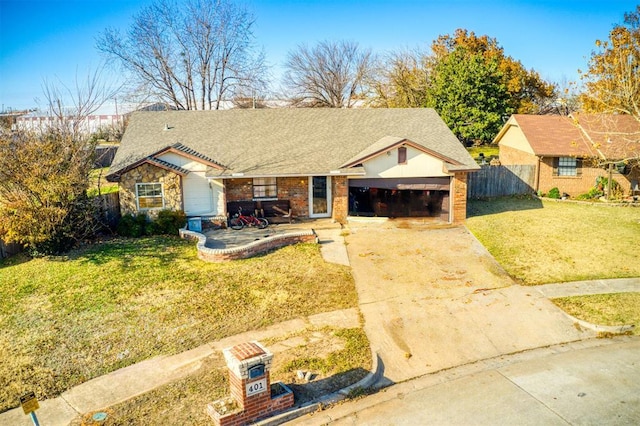 ranch-style house featuring a garage and a front yard