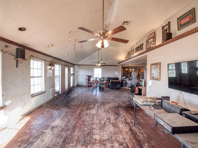 unfurnished living room featuring ceiling fan, dark hardwood / wood-style flooring, crown molding, and high vaulted ceiling