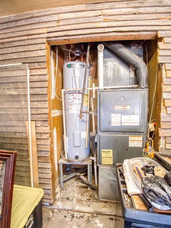 utility room with water heater