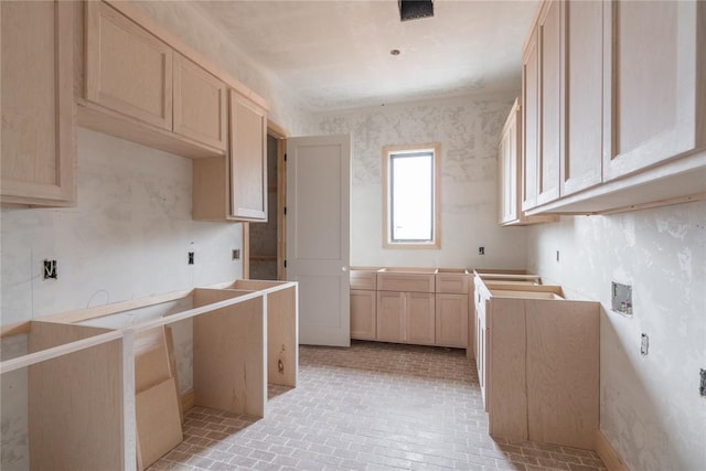 kitchen featuring light brown cabinetry